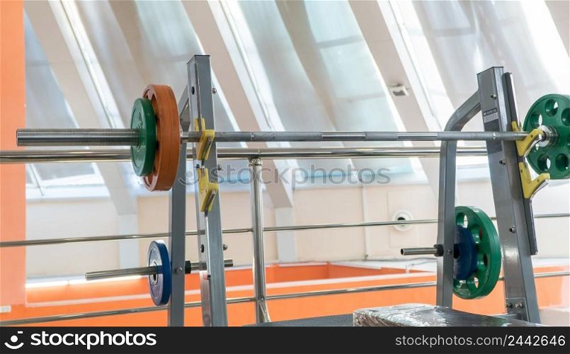 sports equipment and barbells in the gym. sports equipment in the hall