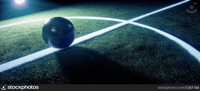 Sports field with football or soccer ball standing on the white lines illuminated from behind by bright spot light at night in a wide angle panorama banner with copy space