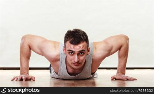 Sports man making pushups,. Care about health and body