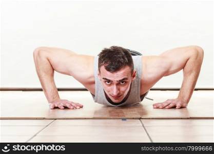 Sports man making pushups,. Care about health and body