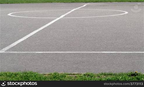 Sports markings on asphalt school playground, basketball lines on an outdoor court