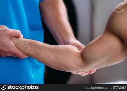 Sports Massage Physical Therapy. Physical Therapist Treating Man&rsquo;s Arm. . Arm Sports Massage Physical Therapy