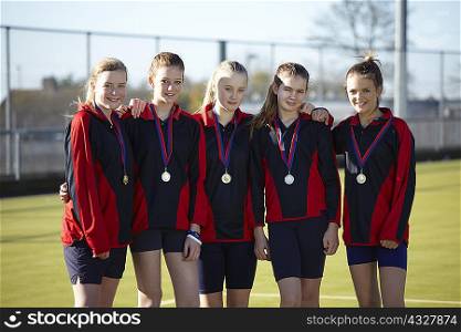 Sports team wearing medals
