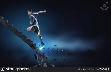 Sportsman overcoming challenges. Sports active man running on stone collapsing ladder