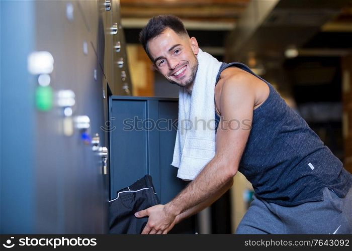 sportsman standing in the locker room at the gym