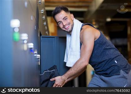 sportsman standing in the locker room at the gym