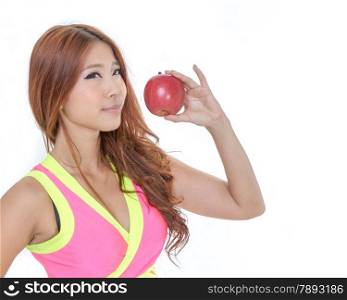 Sporty Asian woman in exercise clothes holding an apple