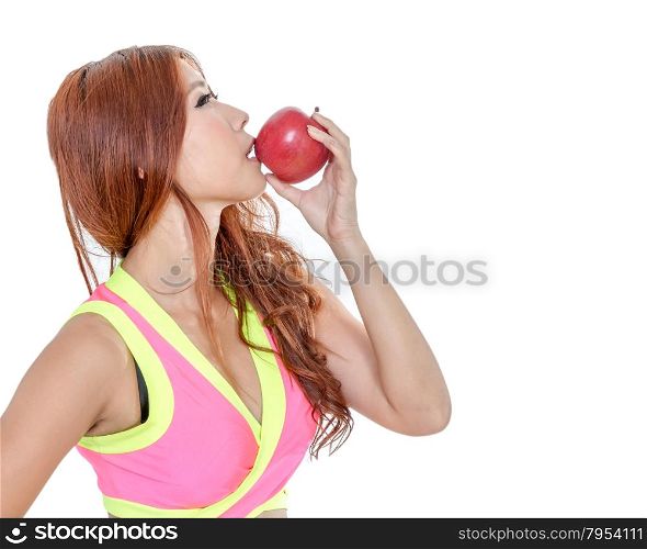 Sporty Asian woman in exercise clothes holding an apple