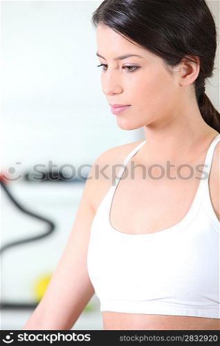 sporty brunette lost in thoughts