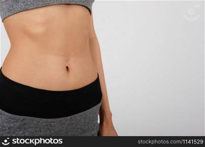 sporty fitness woman in sportswear on white background. healthy sport lifestyle