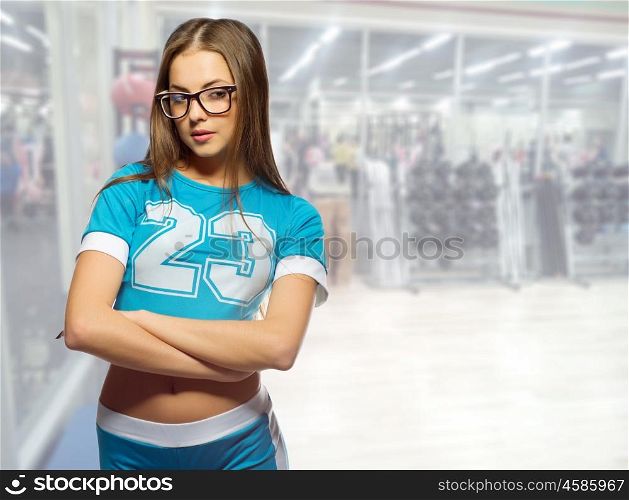 Sporty girl in fitness club