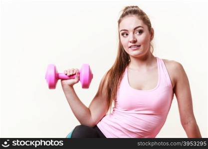 Sporty girl lifting weights. . Sporty girl lifting weights. Female gymnastic exercising with dumbbell. Health fitness workout concept.