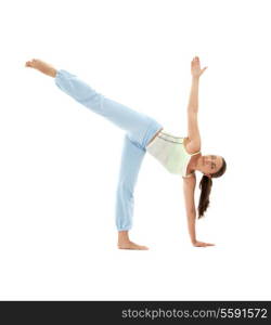 sporty girl practicing ardha chandrasana half moon pose