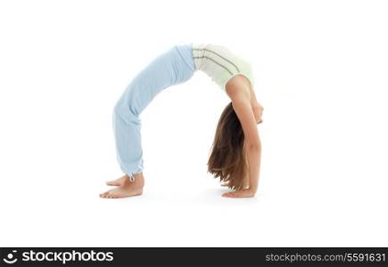 sporty girl practicing urdhva dhanurasana upward bow pose