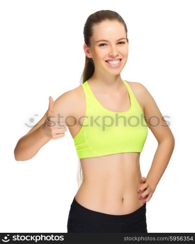 Sporty girl shows ok gesture isolated