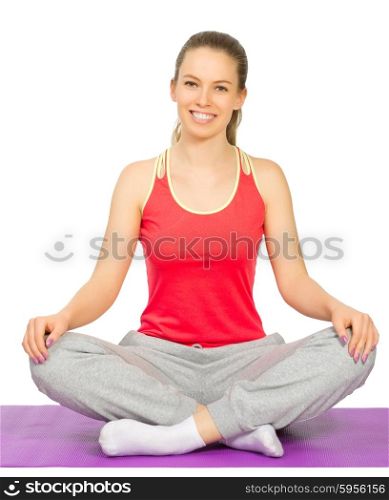 Sporty girl sit on the floor isolated