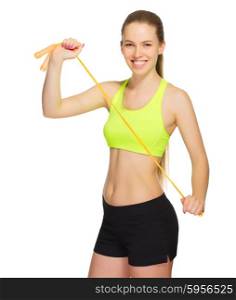 Sporty girl with skipping rope isolated