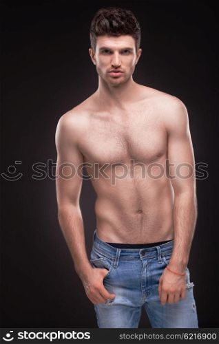 Sporty guy topless in jeans