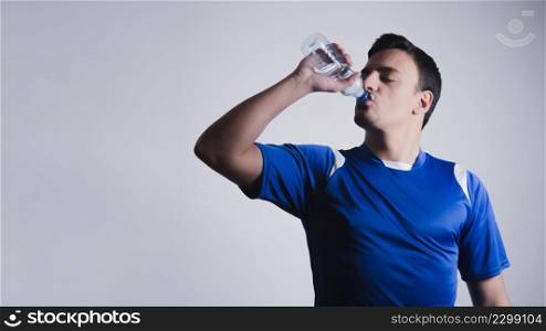 sporty man drinking