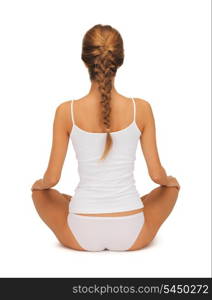 sporty woman in cotton undrewear practicing yoga lotus pose