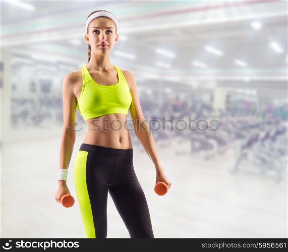 Sporty woman in fitness club