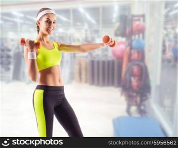 Sporty woman in fitness club