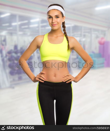 Sporty woman in fitness club