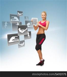 sporty woman pointing at tablet pc and virtual application