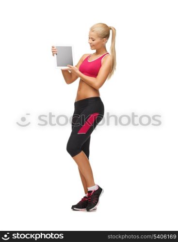 sporty woman showing something on tablet pc