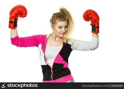 Sporty woman wearing red boxing gloves, winning fight, being motivated feeling relief and happiness. Studio shot on white background.. Woman winner wearing boxing gloves