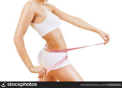 sporty woman with measure in hands on white background