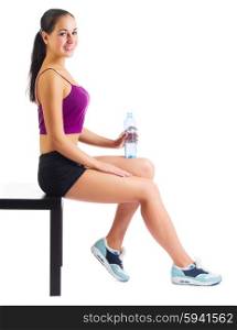 Sporty woman with water bottle sit on bench isolated