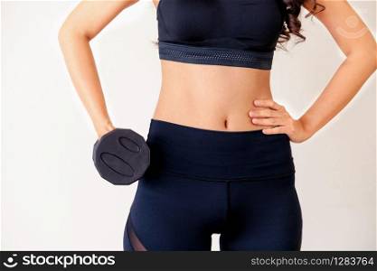 Sporty woman workout with dumbbell on clear background. Healthy lifestyle and exercising.. Sporty woman workout with dumbbell.