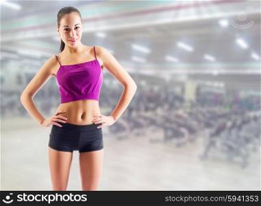 Sporty young girl at fitness club