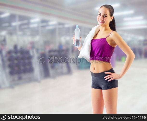 Sporty young girl at fitness club