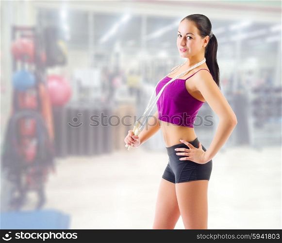Sporty young girl at fitness club