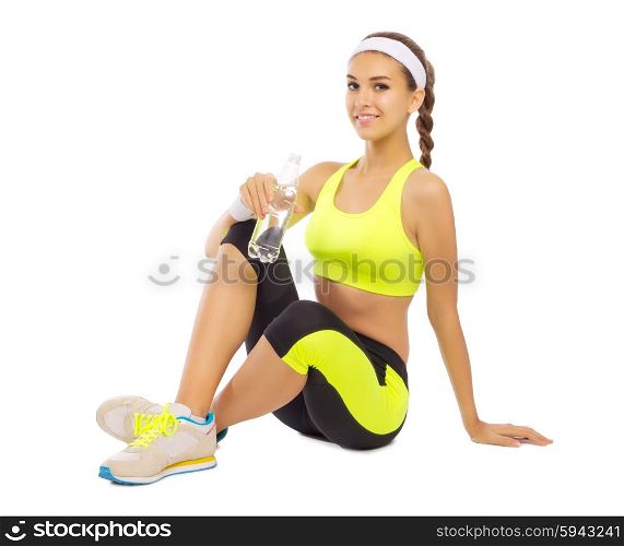Sporty young girl with water isolated