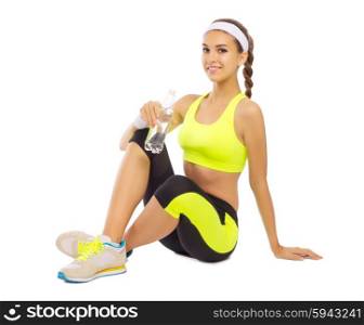 Sporty young girl with water isolated