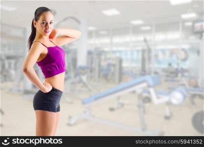 Sporty young woman at gym club