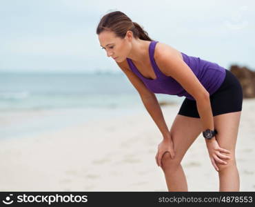 Sporty young woman on the sea coast