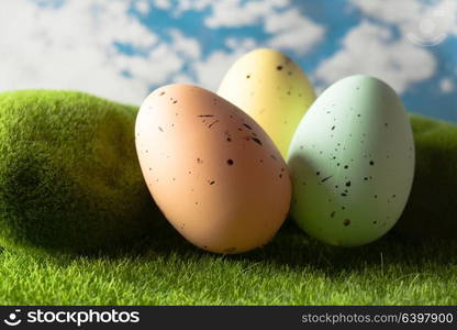 Spotted Easter eggs on the grass. Holiday concept. Easter eggs on the grass