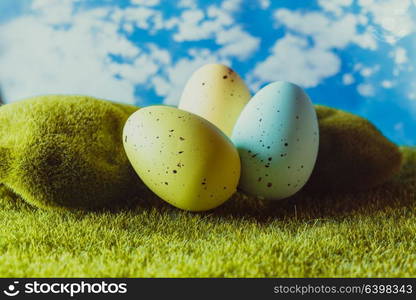 Spotted Easter eggs on the grass. Holiday concept. Easter eggs on the grass