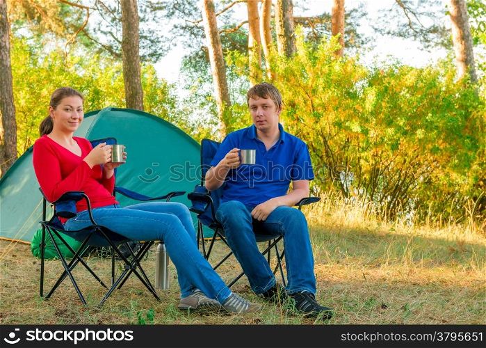 spouses drinking tea in the morning in a camp