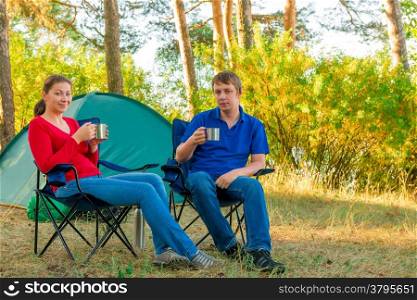 spouses drinking tea in the morning in a camp