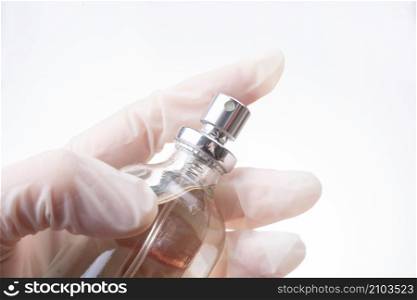 Spray antibacterial or cleaning solution from sprayer bottle. antiseptic, pandemic, coronavirus.