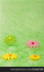 Spring background. Flowers on green sisal background, selective DOF.