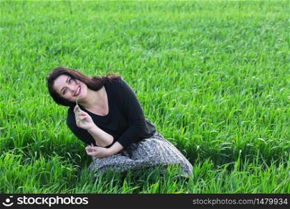 spring - beautiful happy girl at the green field