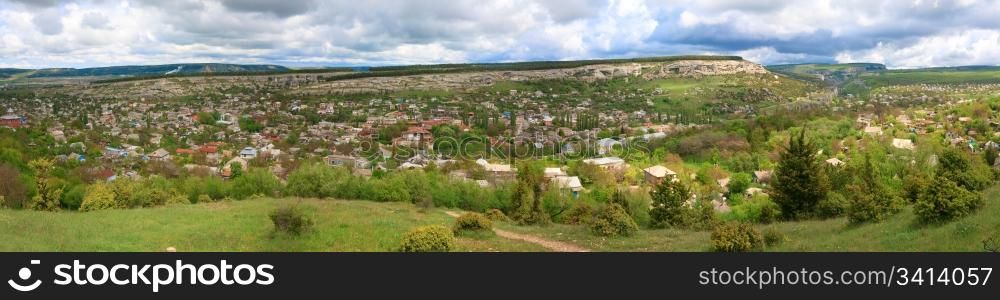 Spring cloudy view of Bakhchisaraj town (Crimea, Ukraine). Four shots stitch image.