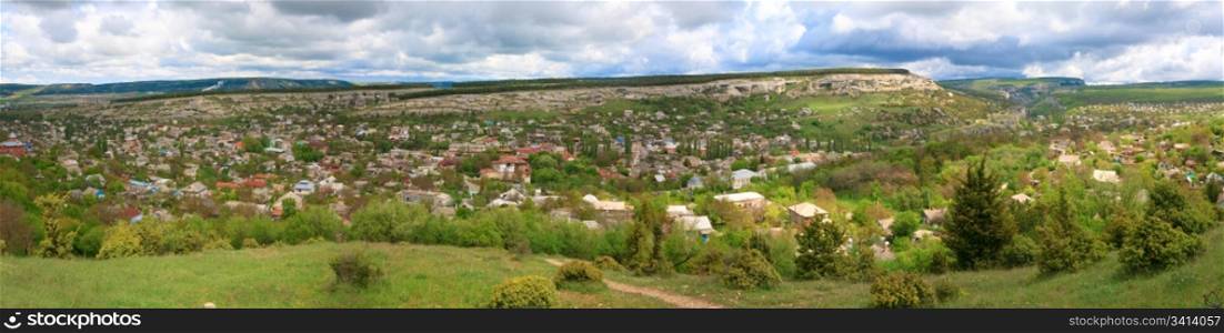 Spring cloudy view of Bakhchisaraj town (Crimea, Ukraine). Four shots stitch image.