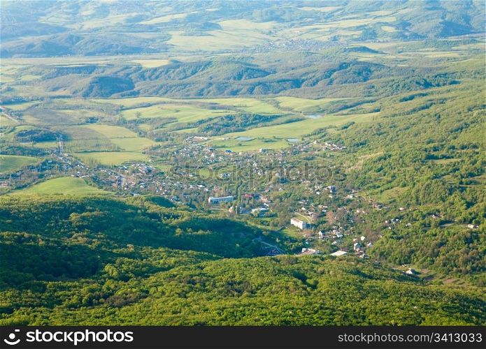 Spring Crimea Mountain country landscape with valley and Sokolinoje Village(Ukraine).